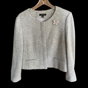 Beige tweed suit with silver thread.